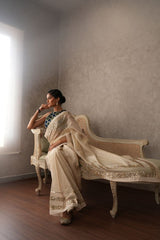 Ivory tissue saree with sequinned borders - Sohni
