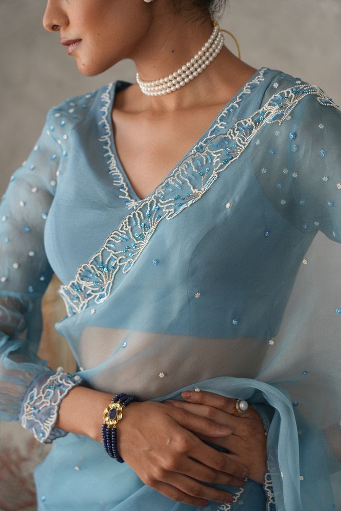 Sky blue organza saree with pearls embroidery cutwork border - Sohni