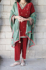 Red short kurta and salwar velvet set with green silk dupatta