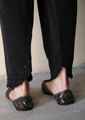 Black urmul cotton salwar with frill edged slanted opening and hand done mirror embroidery
