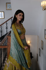 Eggshell blue and mehndi tissue chanderi layered lehenga, halter blouse and striped tissue chanderi dupatta