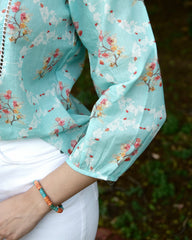 Aqua blue floral print mulmul top with schiffli lace