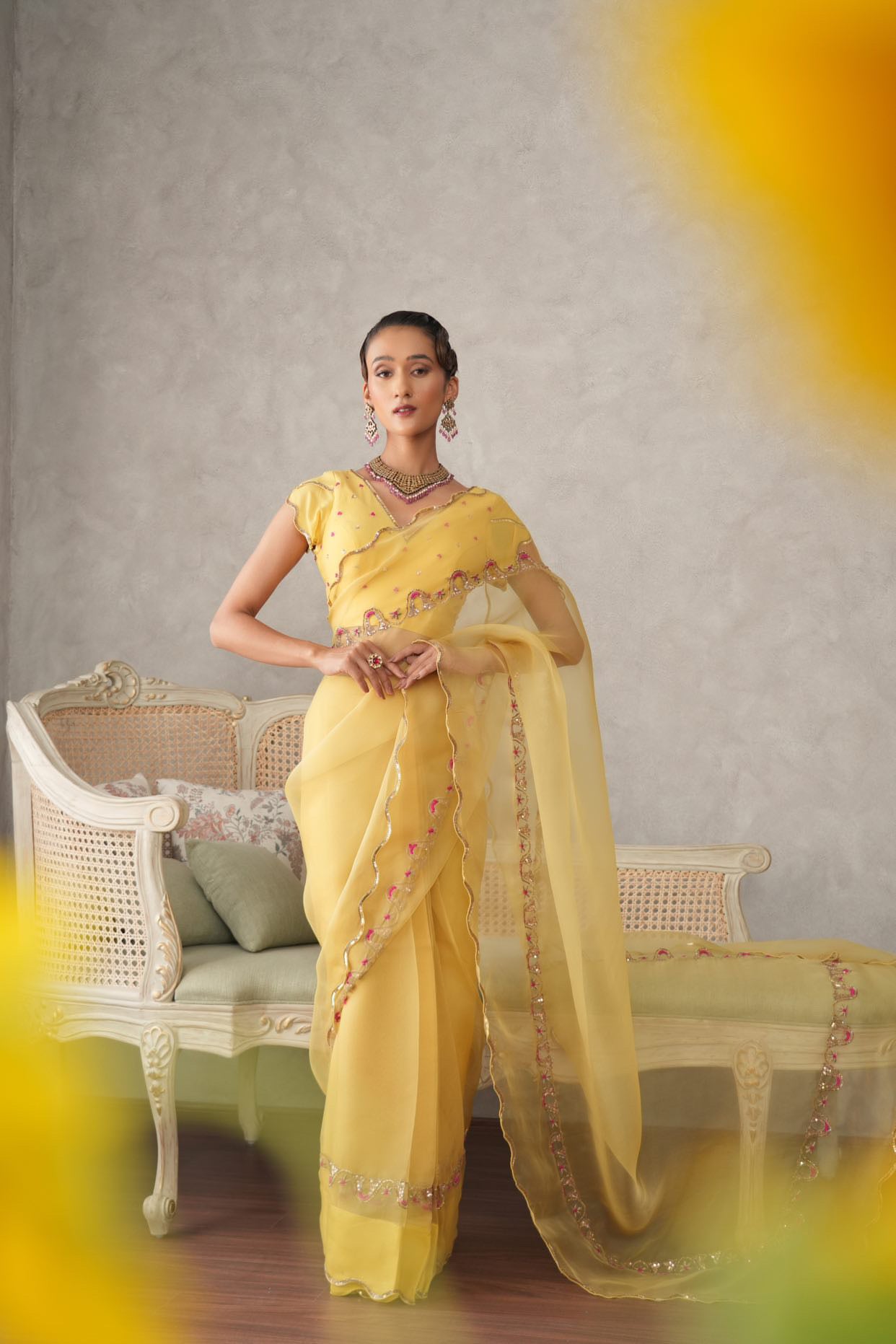 Buttercup yellow organza saree with scalloped edging and embroidered border - Sohni