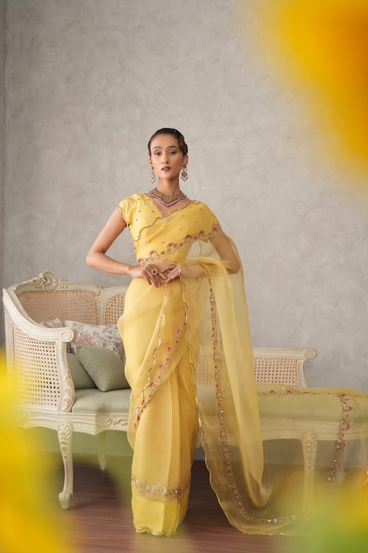 Buttercup yellow organza saree with scalloped edging and embroidered border - Sohni