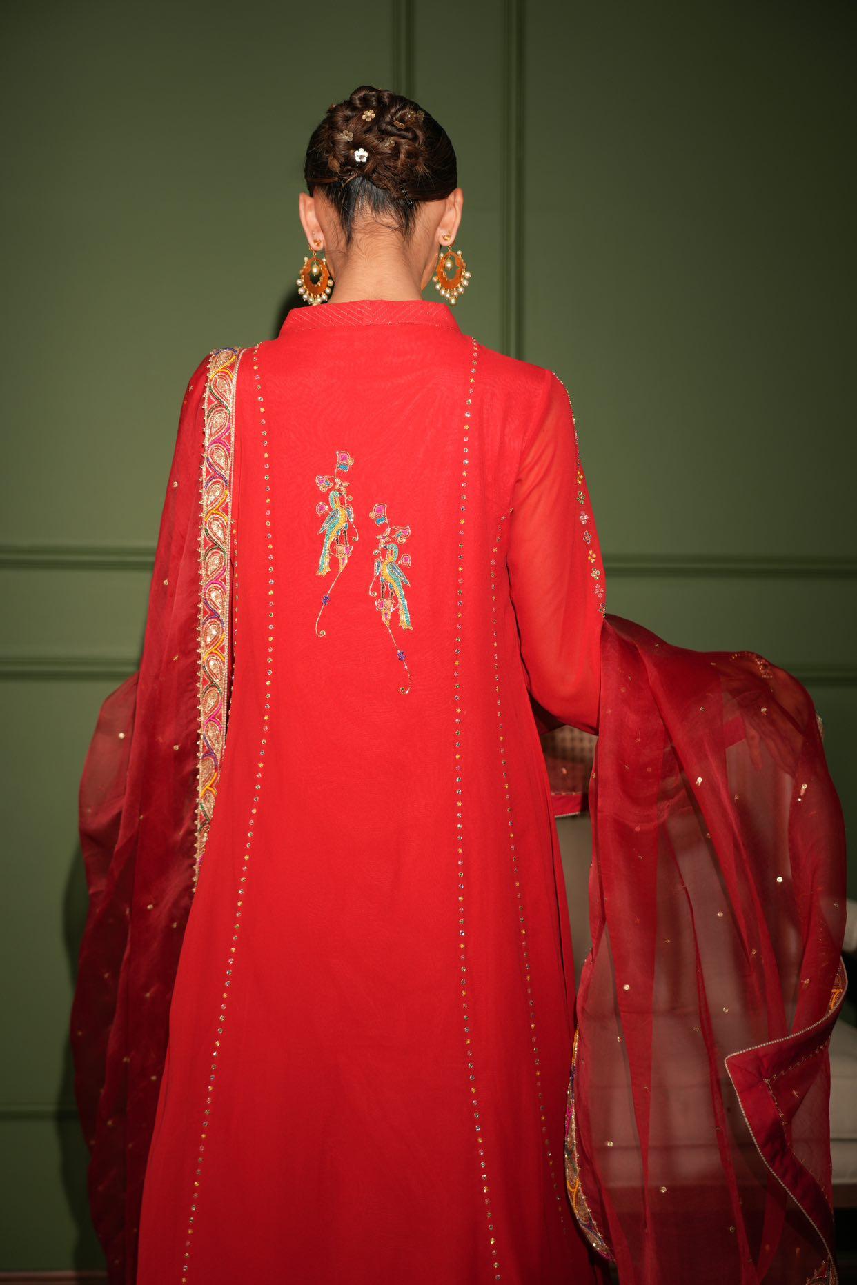 Red overlap kurta set with peacock motifs