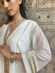 Ivory chanderi overlap kurta set with sequinned embroidery and schiffli detail