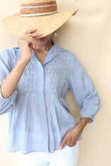 Periwinkle blue crinkle cotton top with twisted pleats