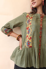 Green organic mulmul peplum top with Kalamkari borders