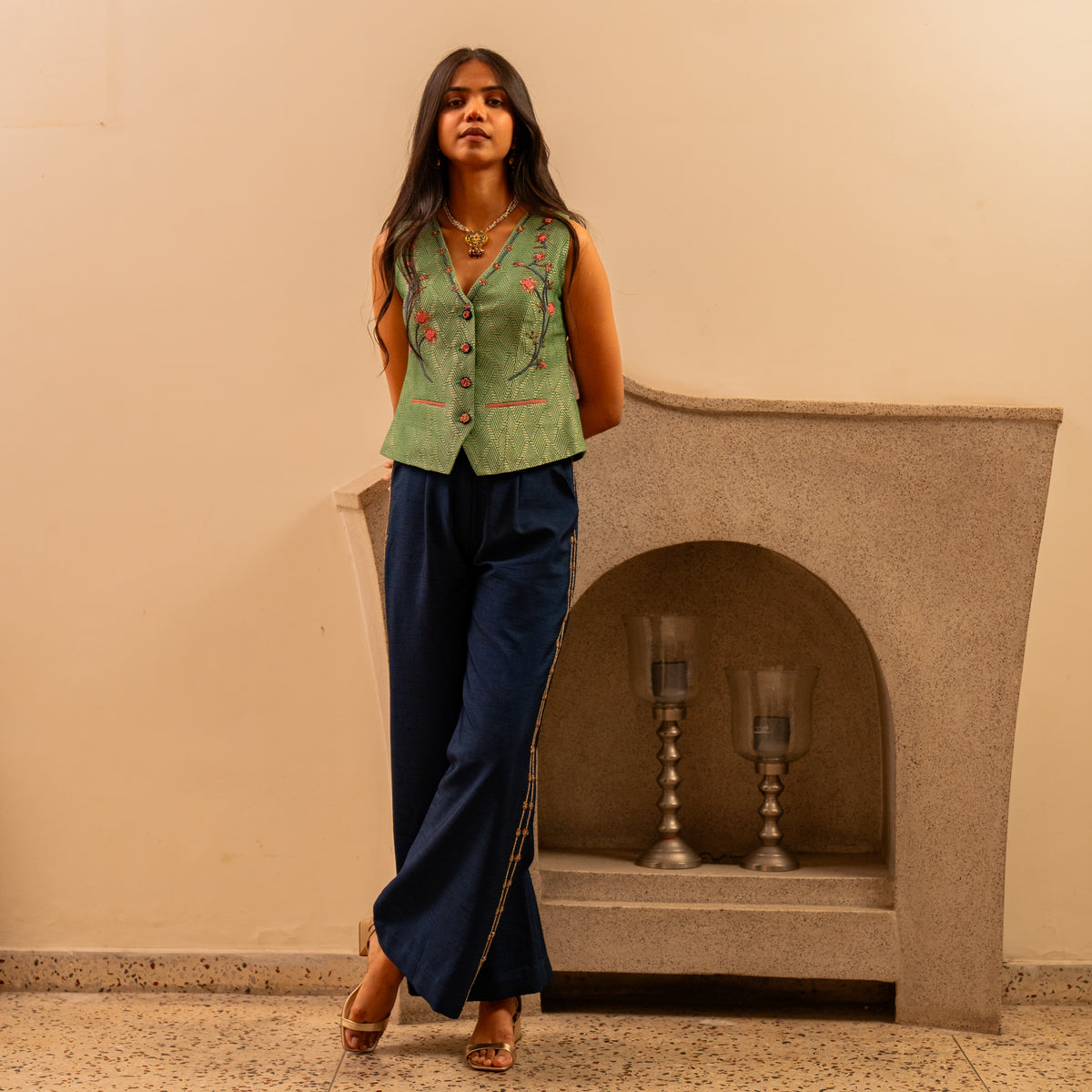 Forest green banarsi waistcoat with embroidered indigo pants