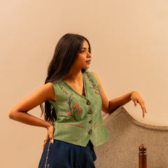 Forest green banarsi waistcoat with embroidered indigo pants