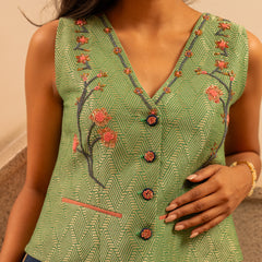 Forest green banarsi waistcoat with embroidered indigo pants