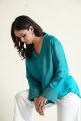 Peacock blue modal silk long sleeved top with embroidered cuffs