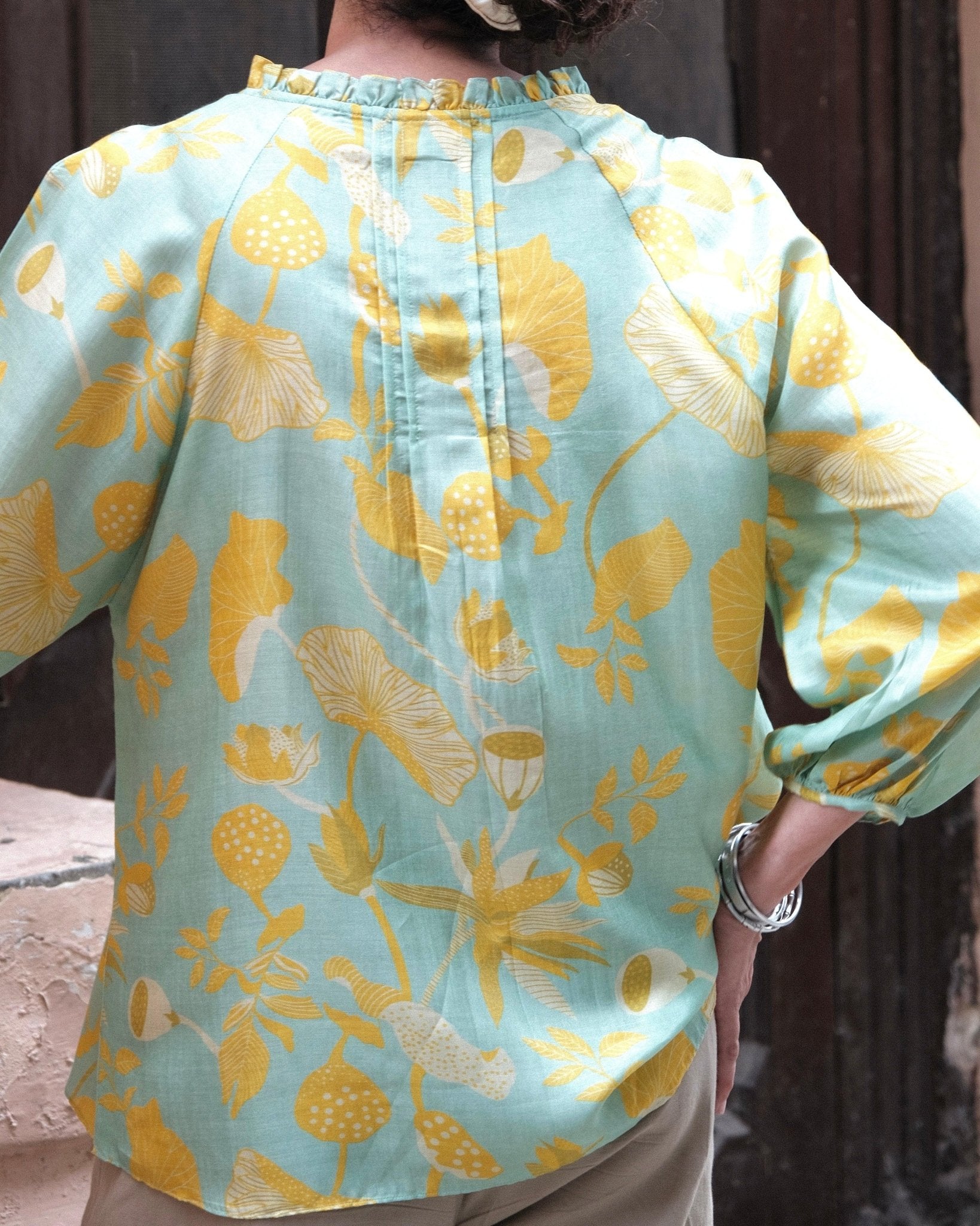 Aqua green and mustard lotus print pleated muslin blouse - Sohni