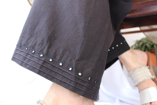 Black organic handwoven cotton palazzos with pintucks and mirror work detail - Sohni