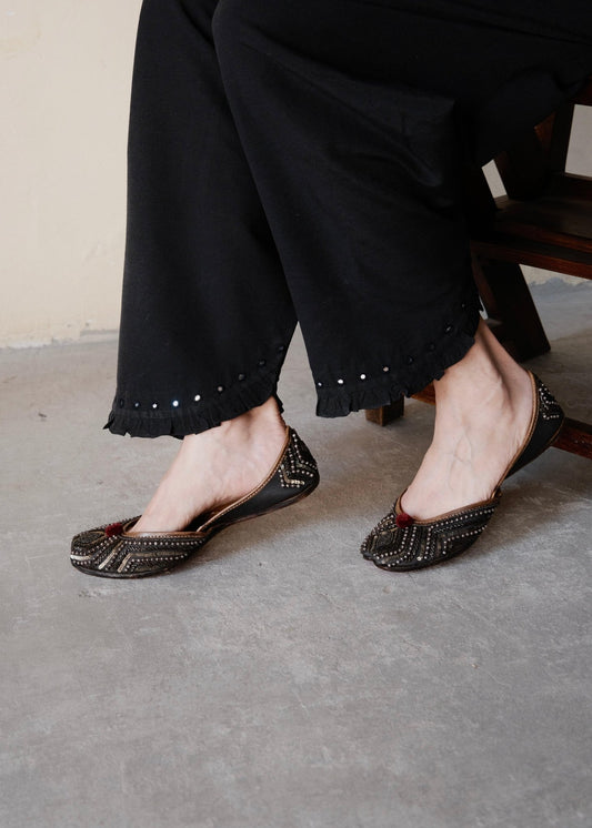 Black urmul cotton salwar with frill edged slanted opening and hand done mirror embroidery - Sohni