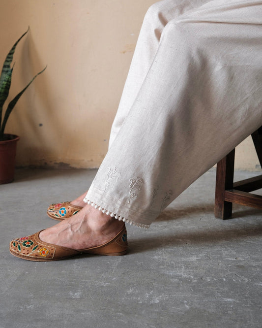 Cream (greige) slub cotton salwar with dori booti embroidery and lace edging - Sohni