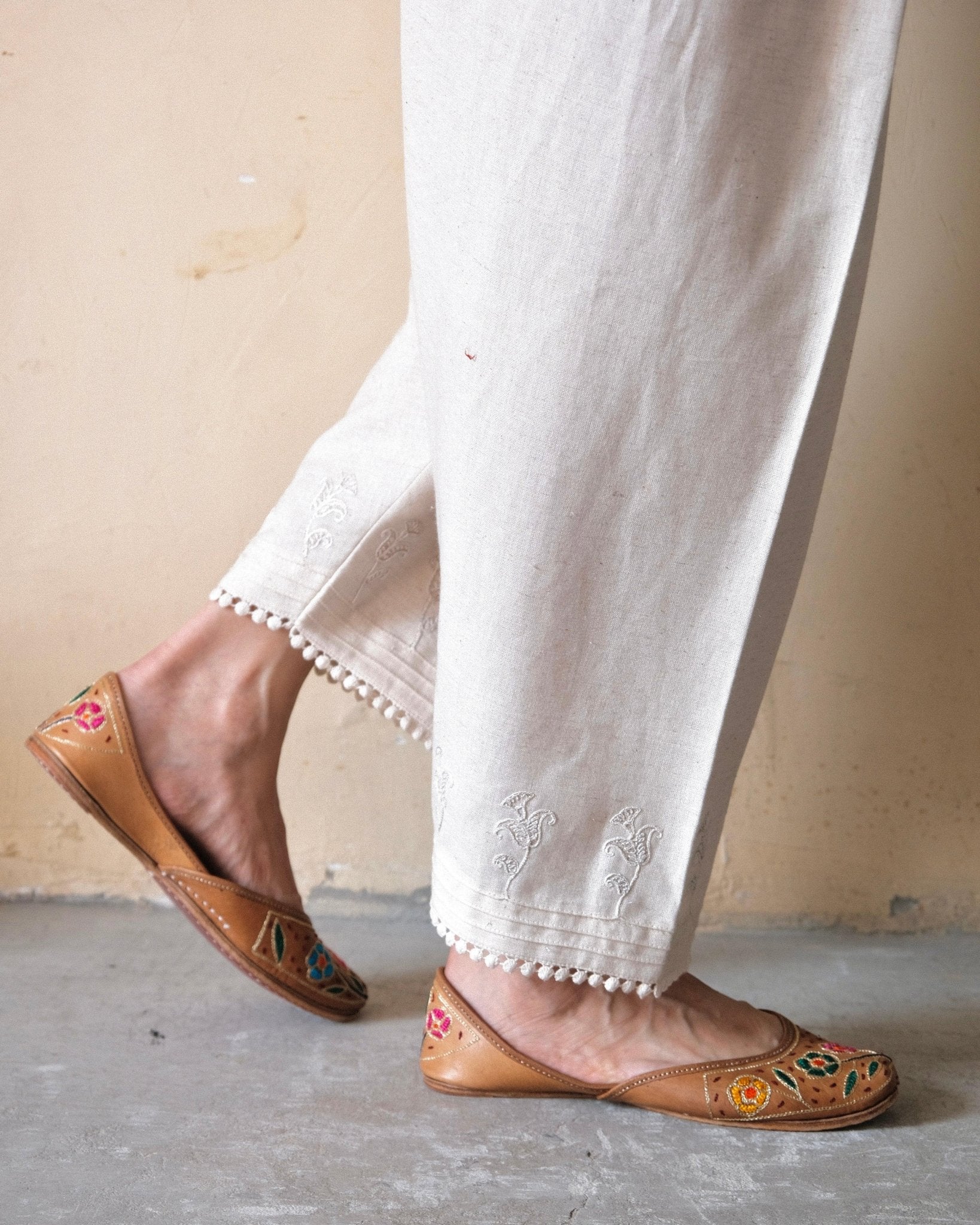 Cream (greige) slub cotton salwar with dori booti embroidery and lace edging - Sohni