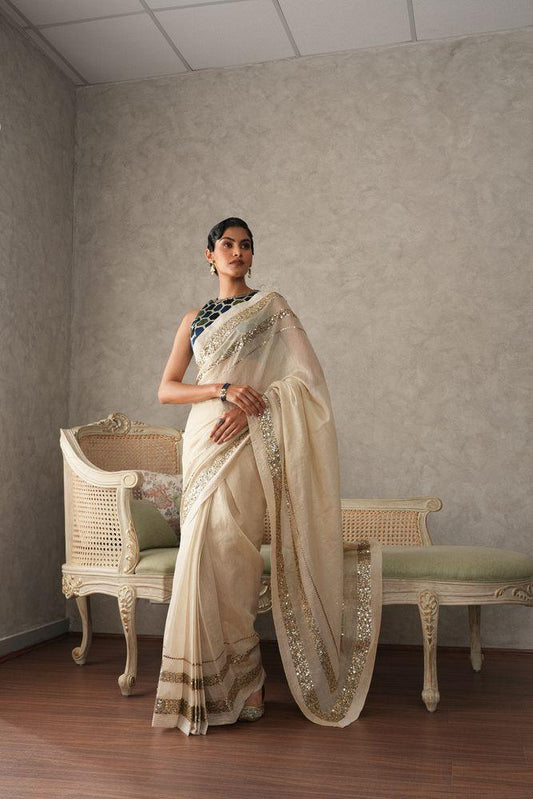Ivory tissue saree with sequinned borders - Sohni