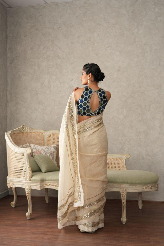 Ivory tissue saree with sequinned borders - Sohni
