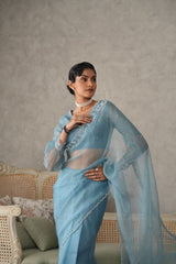 Sky blue organza saree with pearls embroidery  cutwork border