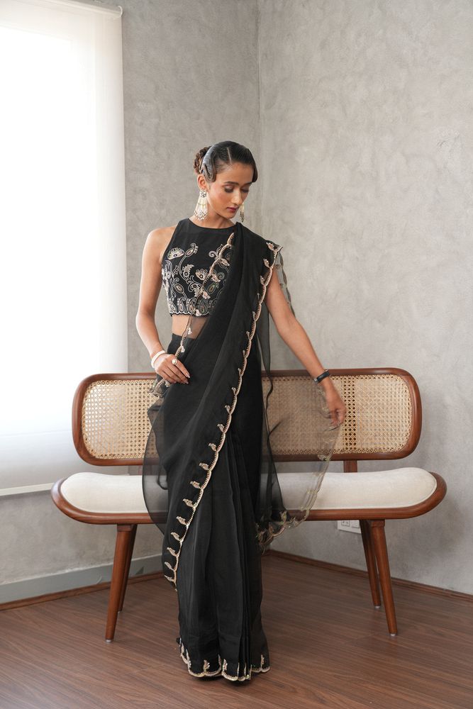 Black organza scalloped edge saree with paisleys embroidery blouse