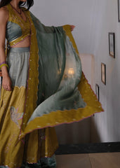 Eggshell blue and mehndi tissue chanderi layered lehenga, halter blouse and striped tissue chanderi dupatta - Sohni