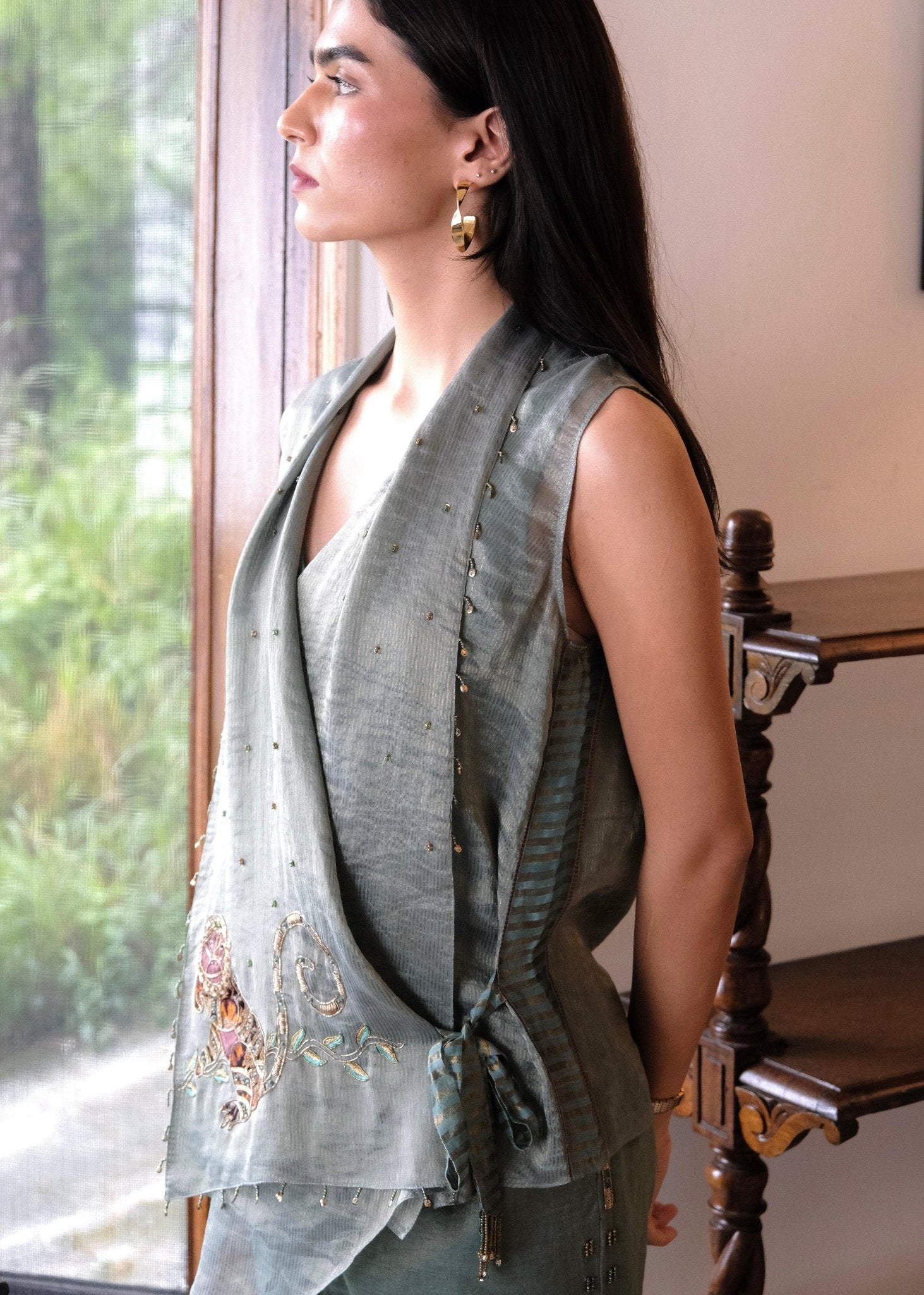 Eggshell striped tissue chanderi asymmetrical wrap top and tapered pants with monkey motif embroidery - Sohni