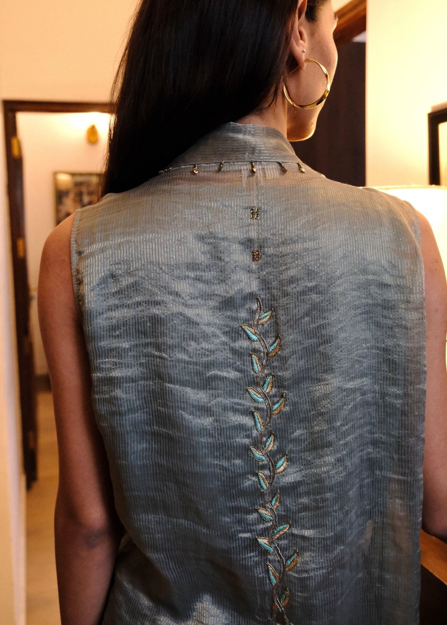 Eggshell striped tissue chanderi asymmetrical wrap top and tapered pants with monkey motif embroidery - Sohni