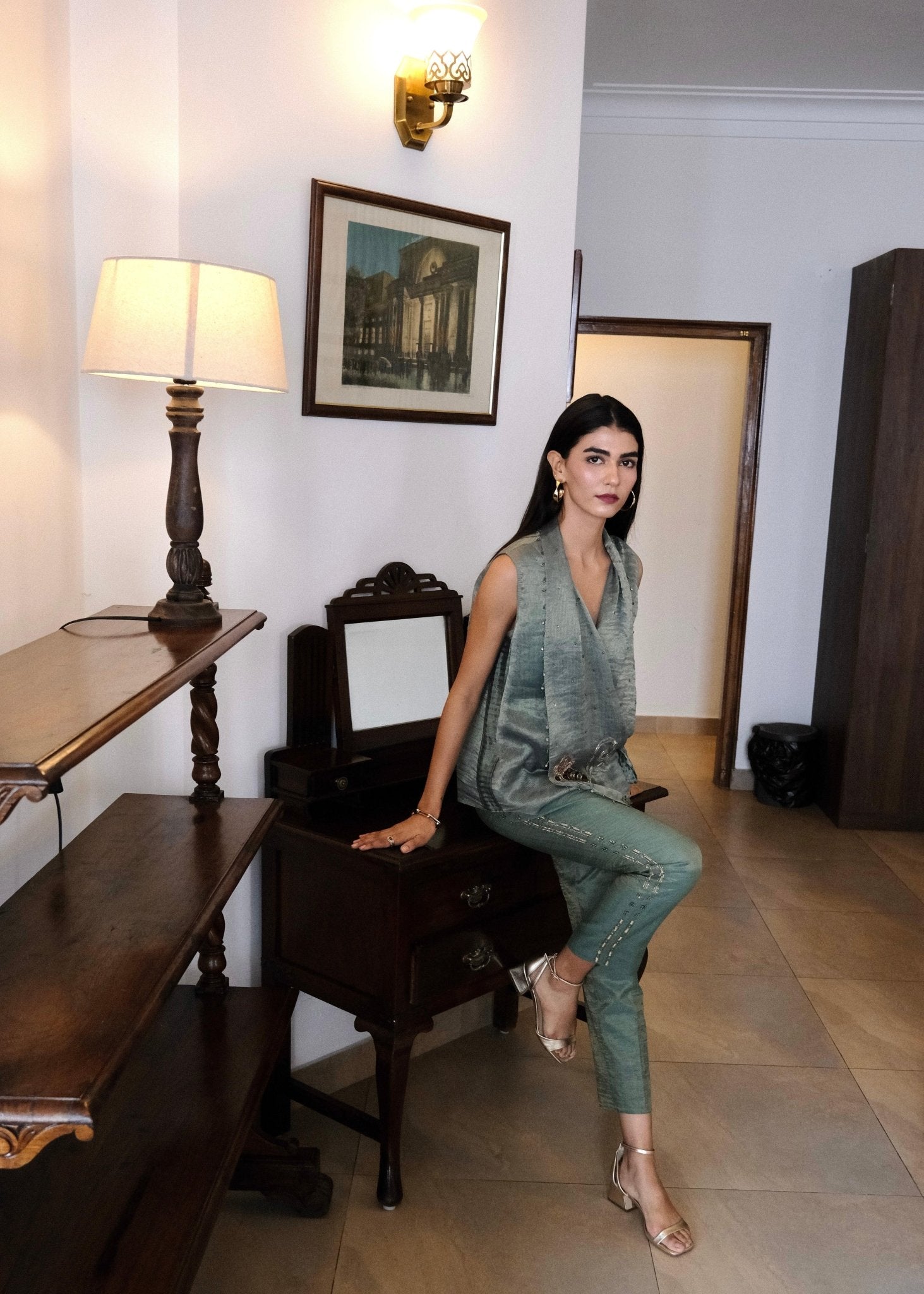 Eggshell striped tissue chanderi asymmetrical wrap top and tapered pants with monkey motif embroidery - Sohni