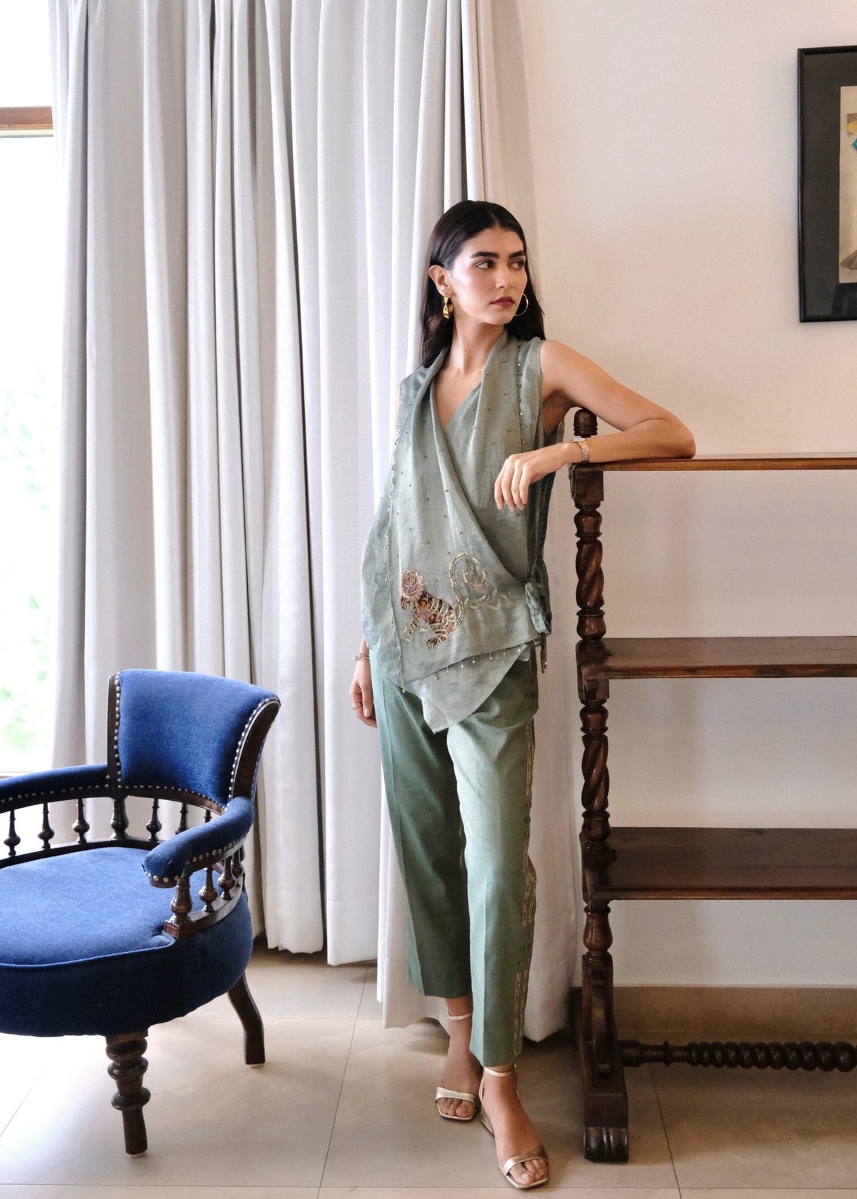 Eggshell striped tissue chanderi asymmetrical wrap top and tapered pants with monkey motif embroidery - Sohni