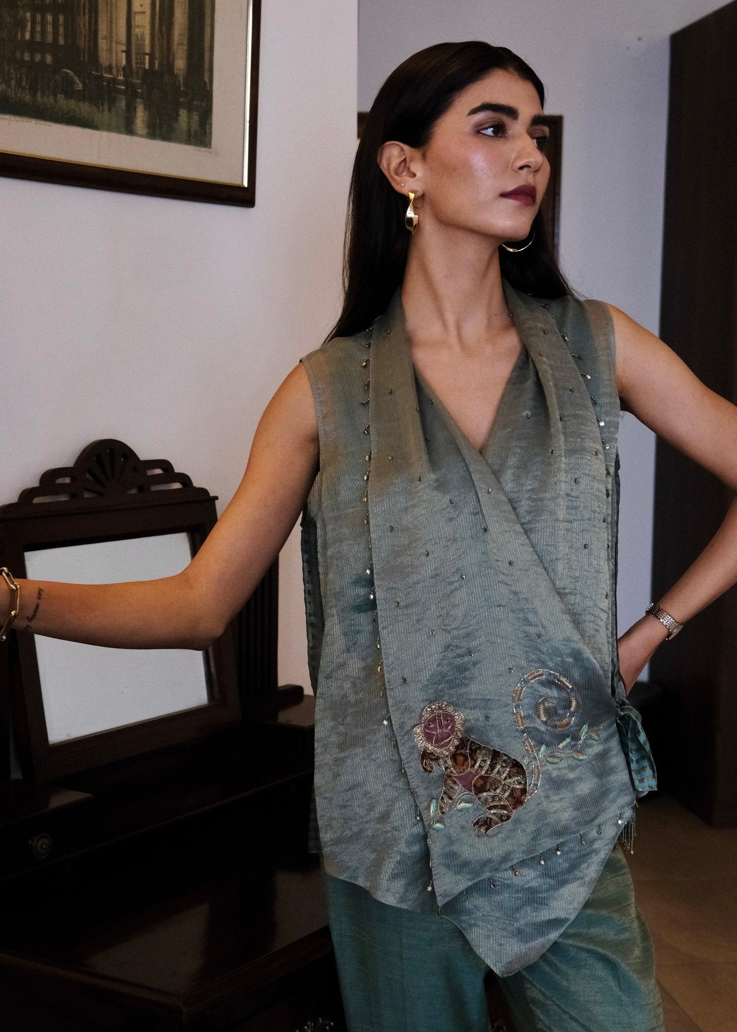 Eggshell striped tissue chanderi asymmetrical wrap top and tapered pants with monkey motif embroidery - Sohni