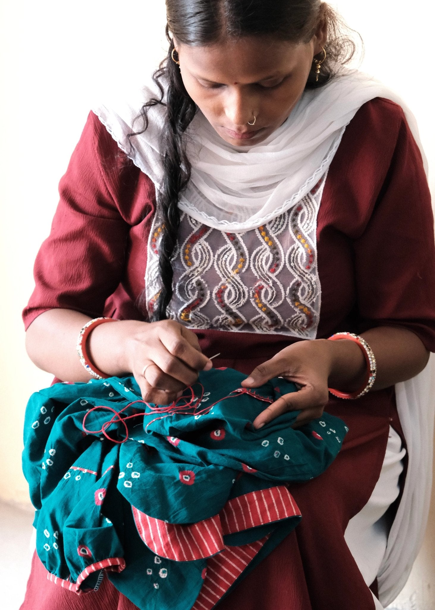 Flame red bandhej shirt with hand embroidery detailing - Sohni