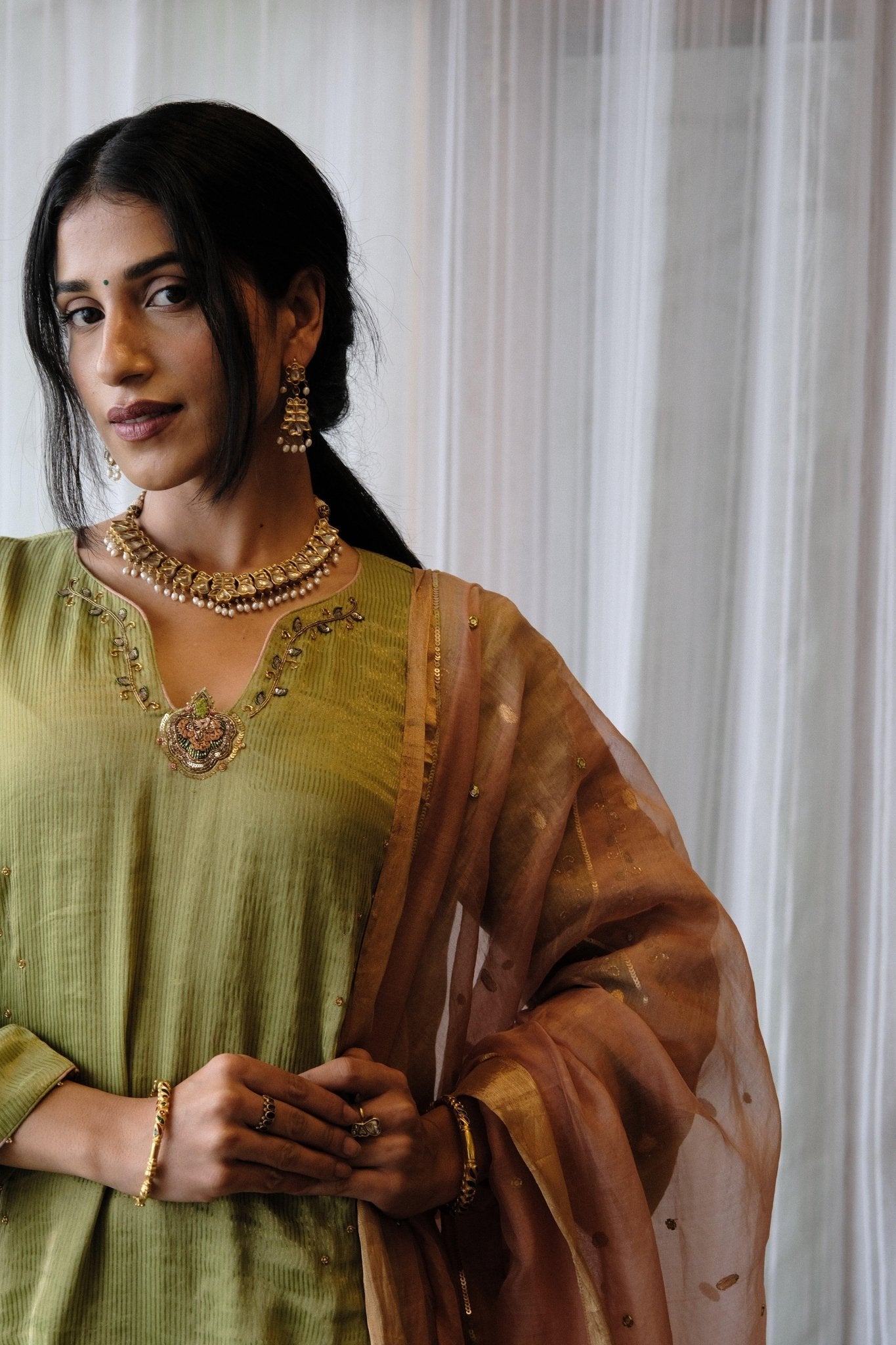 Sap green striped tissue chanderi kurta set with peach gold booti organza dupatta and exotic birds embroidery - Sohni