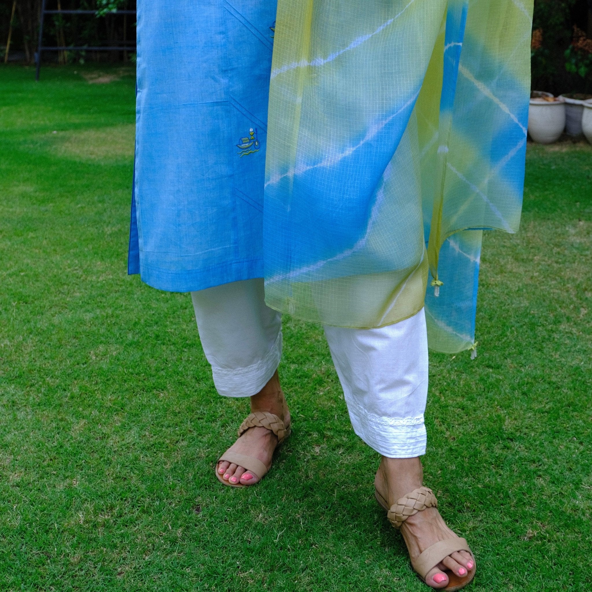 Sky blue mangalgiri pintucked kurta with Warli boat motif embroidery, white dobby salwar and lehriya kota doria dupatta - Sohni