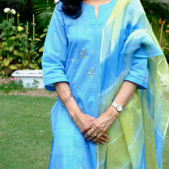Sky blue mangalgiri pintucked kurta with Warli boat motif embroidery, white dobby salwar and lehriya kota doria dupatta - Sohni