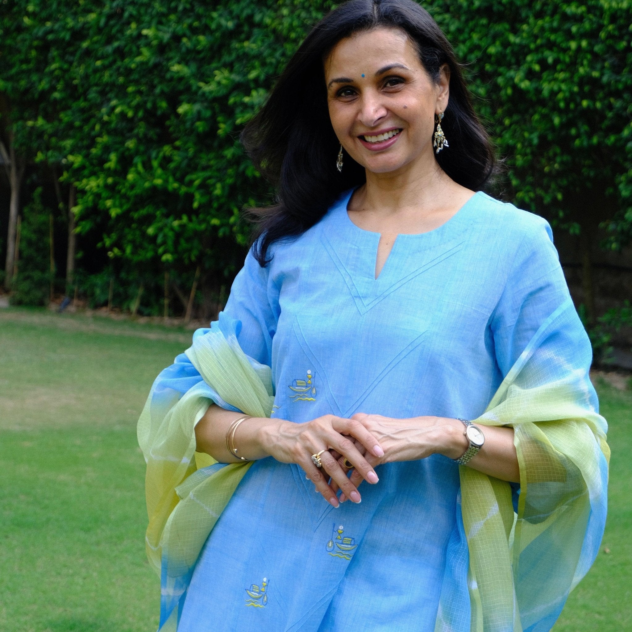 Sky blue mangalgiri pintucked kurta with Warli boat motif embroidery, white dobby salwar and lehriya kota doria dupatta - Sohni