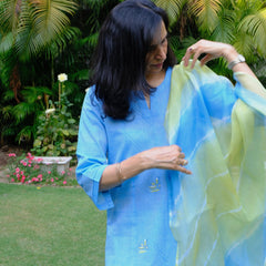Sky blue mangalgiri pintucked kurta with Warli boat motif embroidery, white dobby salwar and lehriya kota doria dupatta - Sohni