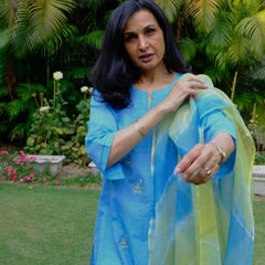 Sky blue mangalgiri pintucked kurta with Warli boat motif embroidery, white dobby salwar and lehriya kota doria dupatta - Sohni