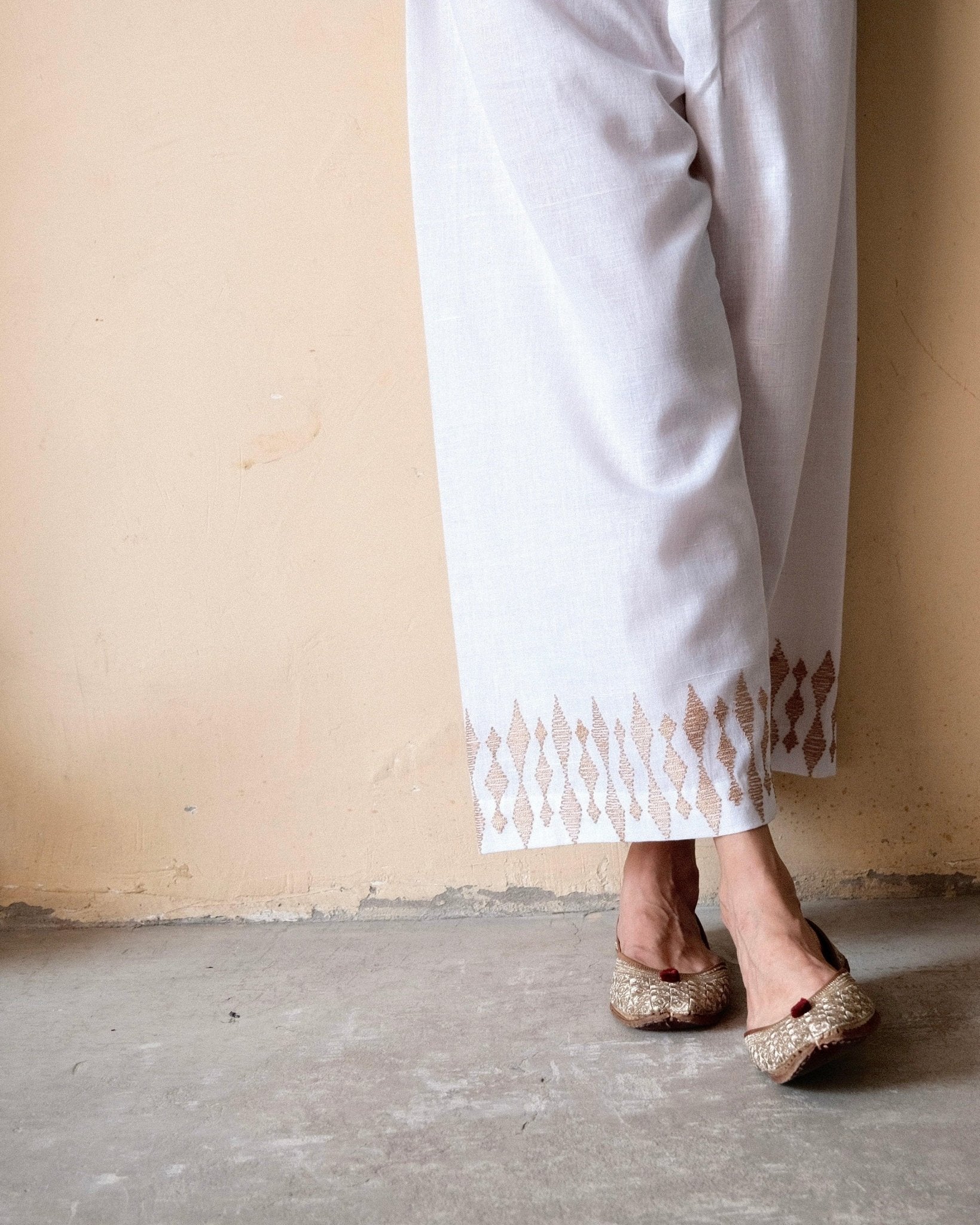 White handloom cotton palazzo pants with beige dori embroidery - Sohni