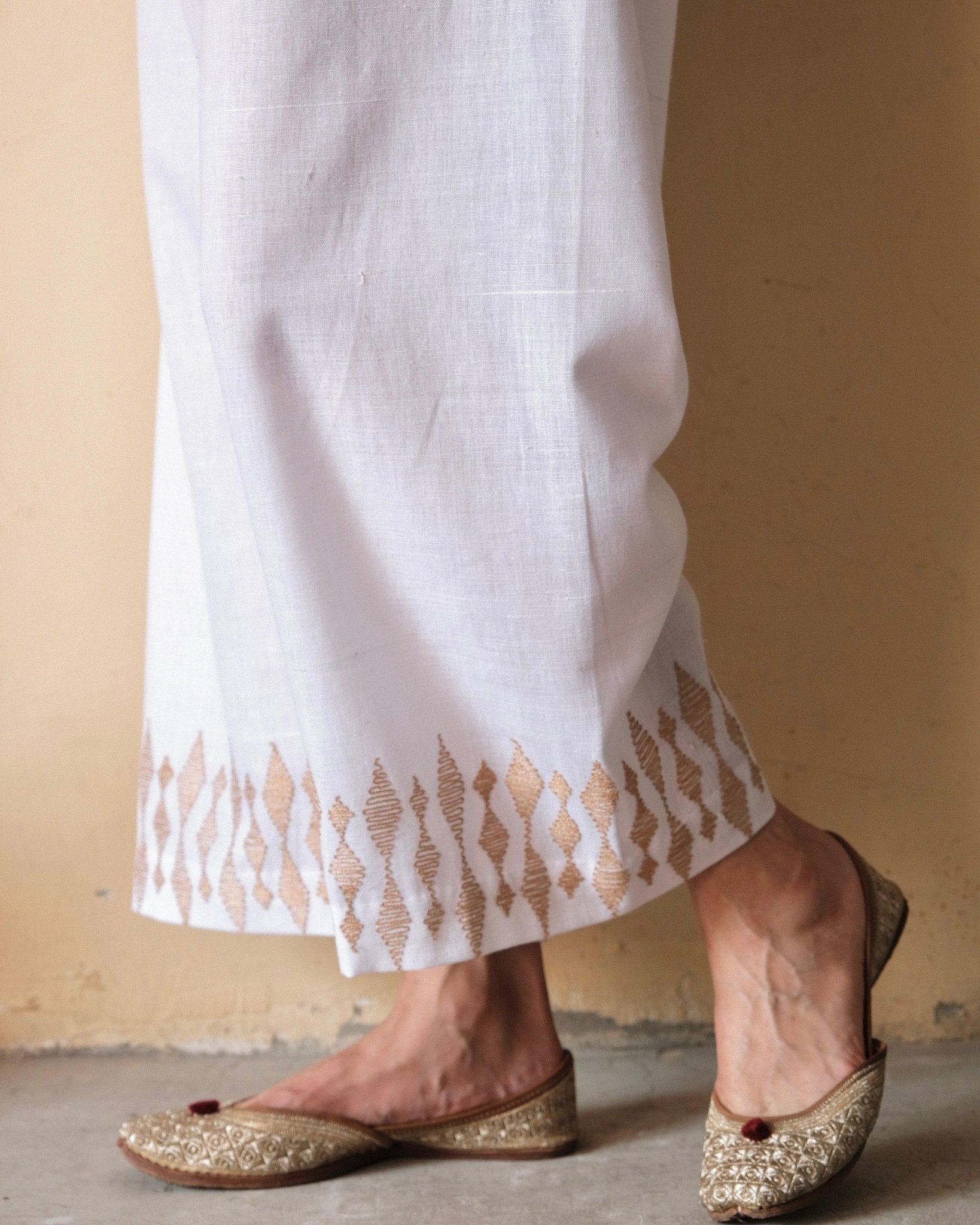 White handloom cotton palazzo pants with beige dori embroidery - Sohni