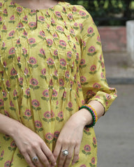 Yellow booti jaal muslin honeycomb smocked kurta, dobby salwar and lehriya dupatta - Sohni