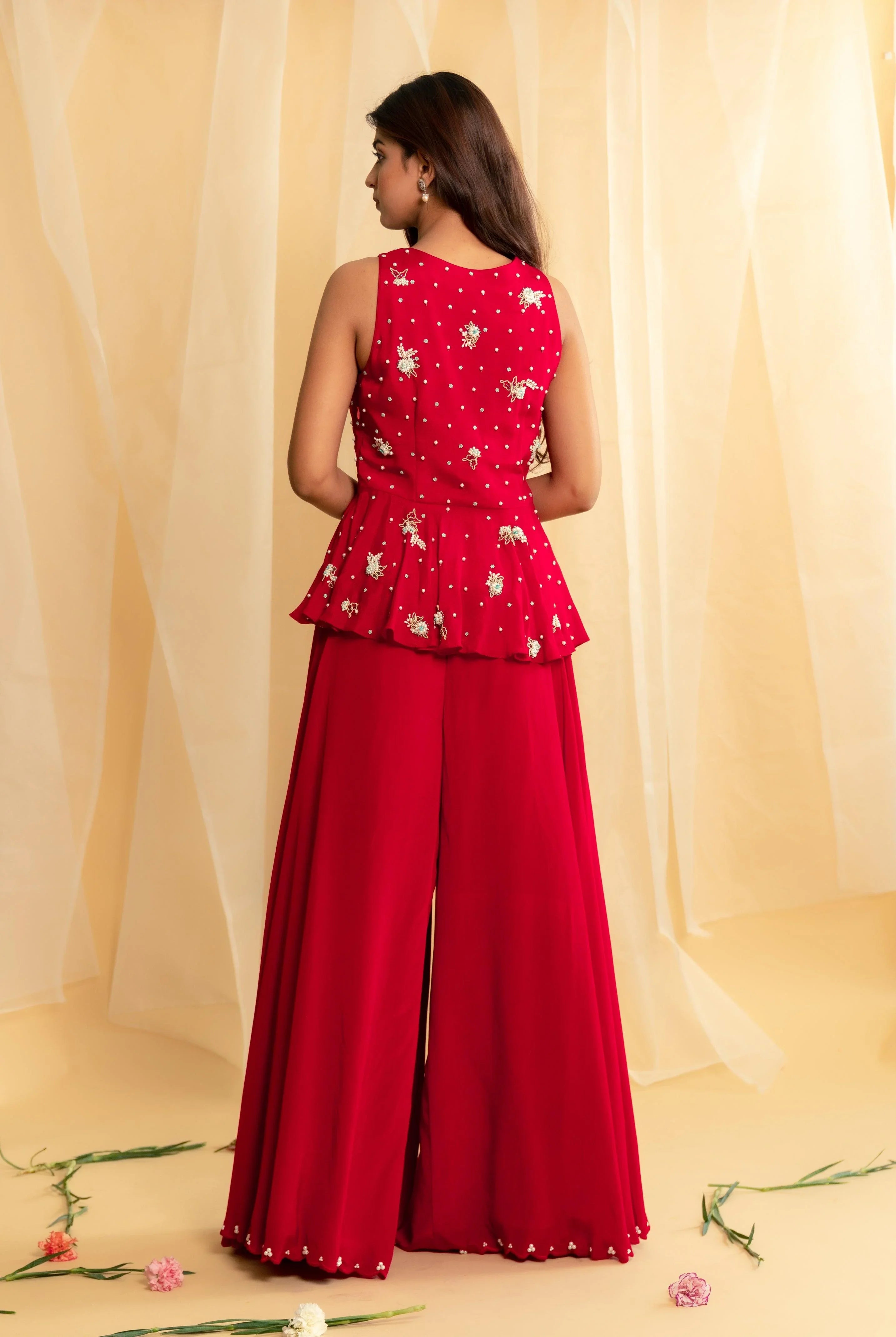 Red peplum top with pearls embroidery and flared palazzo pants set